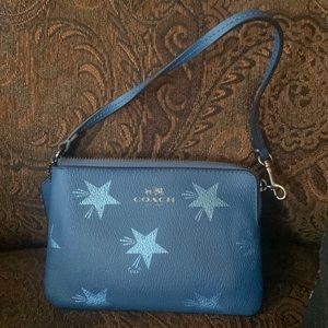 A Coach wristlet new with tag